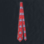 Abstract red and blue Christmas snowflakes Tie<br><div class="desc">Abstract blue and white Christmas snowflakes pattern on a red background. Need more? Check out other holiday designs at my store! Cheers! :)</div>