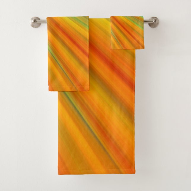 Abstract  red yellow orange green stripes on blue bath towel set (Insitu)