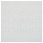 Abstract repeating pattern of stylized shapes in l fabric