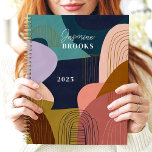Abstract Shapes Geometric Lines Custom Name Planner<br><div class="desc">This bold and modern design features a vibrant abstract composition of organic shapes in deep navy, mustard, blush, and olive tones. Fine gold linework adds a touch of sophistication, while the personalized name and year create a unique and stylish finish. Perfect for artists, students, or professionals who love trendy and...</div>