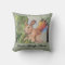 Accent pillow with rabbit in garden.