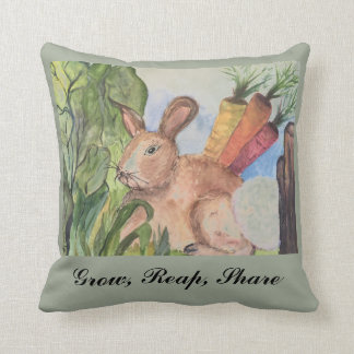 Accent pillow with rabbit in garden.