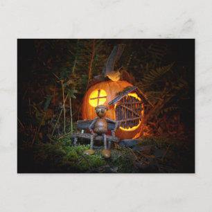 Acorn elf is sitting in front of pumpkin house postcard