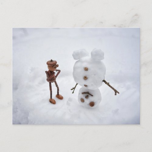 Acorn elf making a snowman winter postcard