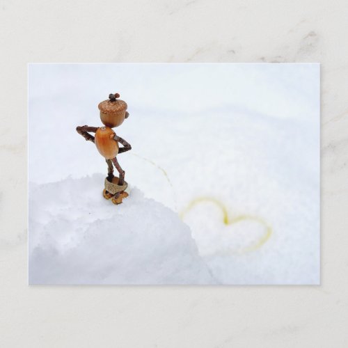 Acorn elf making a yellow heart in the snow winter postcard