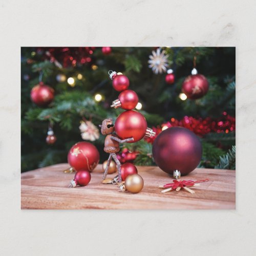 Acorn elf playing with Christmas decorations Postcard