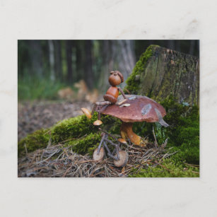Acorn elf with bike resting on mushroom postcard