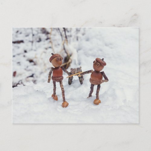 Acorn elves ride on a sleigh winter postcard