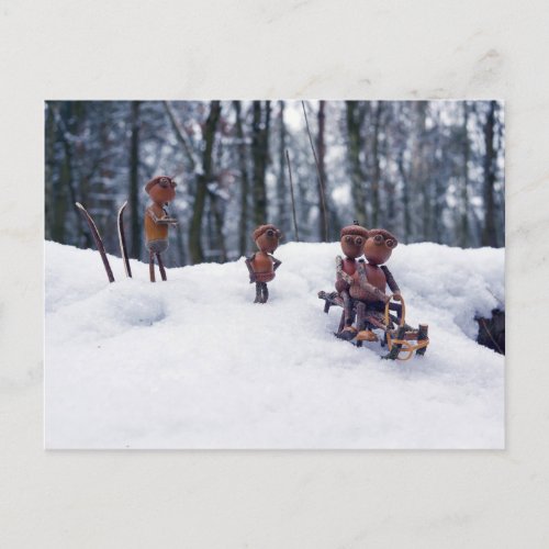 Acorn elves ride sledge winter postcard