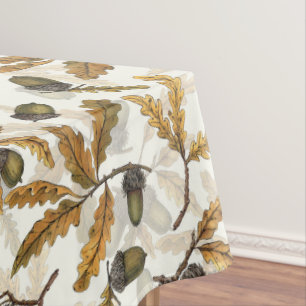 Acorns and oak leaves on off white tablecloth