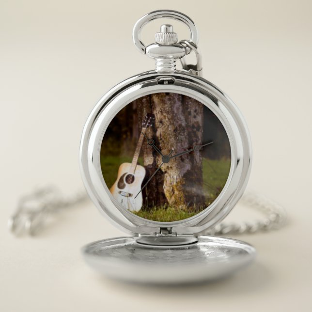 acoustic  guitar against tree pocket watch (Inside)