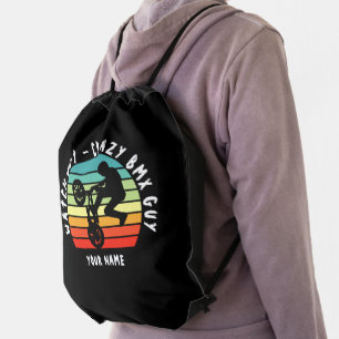 Add Name Change ALL Text Watch Out Crazy BMX Guy Drawstring Bag