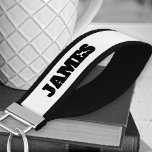 Add Your Name Bold Typography Black and White Wrist Keychain<br><div class="desc">Personalized wrist keychain with your name printed on both sides. This simple and minimalist design features bold headline typography in a minimal color palette of black and white.</div>