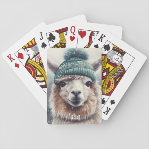 Adorable alpaca wearing blue beanie  playing cards