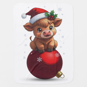 adorable baby highland cow sitting blanket