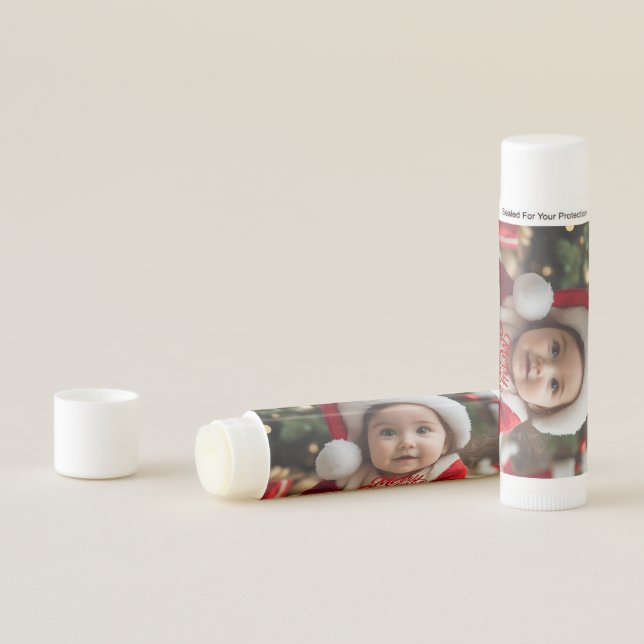 Adorable Baby in Santa Outfit with Christmas Lip Balm (In Situ)