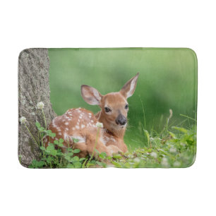 Adorable Fawn laying under a tree Bath Mat