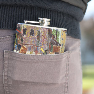 Adorable playful fluffy cute kitten in the city flask