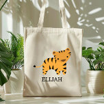 Adorable Tiger Kids' Personalized Tote Bag<br><div class="desc">This kids' tote bag for animal lovers features a cute illustration of a tiger. Personalize it with your child's name in black letters. Makes a great book bag for boys or girls!</div>