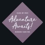 Adventure Awaits Script Purple Personalized Graduation Cap Topper<br><div class="desc">Personalized graduation cap topper featuring "Adventure Awaits!" in a white hand-lettered script with a purple background or color of your choice. Personalize the Adventure Awaits graduation cap topper by adding the graduate's name and graduation year. Perfect for both high school and college graduates.</div>