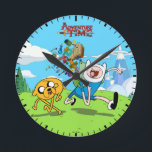 Adventure Time | Finn's Backpack Adventure Gear Round Clock<br><div class="desc">Check out this fun graphic of Jake and Finn running, as Finn's backpack opens and spills out adventure gear!</div>