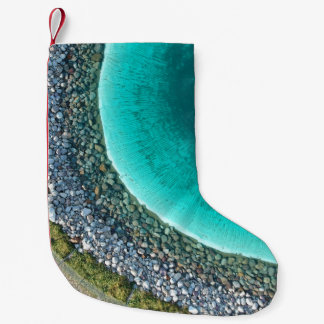 Aerial photography of body of water surrounded wit small christmas stocking
