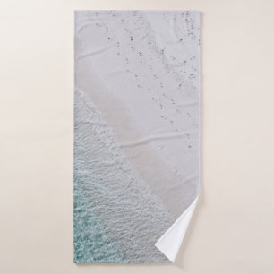AERIAL PHOTOGRAPHY OF WHITE SAND SEASHORE AND GREE BATH TOWEL