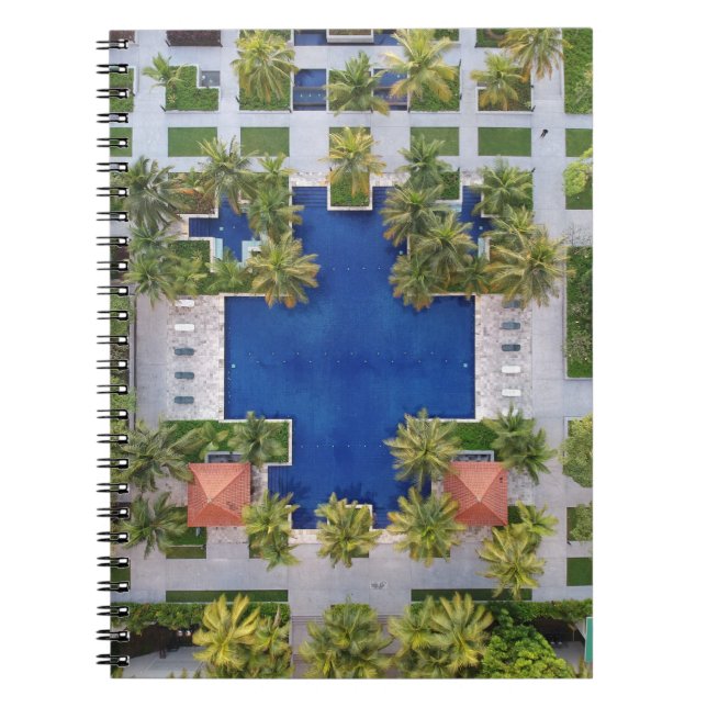Aerial view of pool surrounded by palm trees notebook (Front)