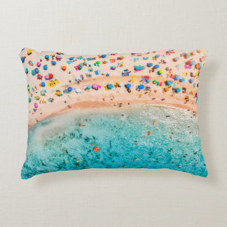 Aerial view of sandy beach with colorful umbrellas accent pillow