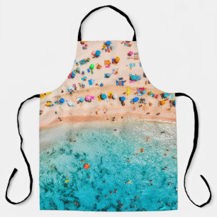Aerial view of sandy beach with colorful umbrellas apron