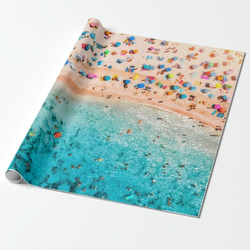 Aerial view of sandy beach with colorful umbrellas wrapping paper