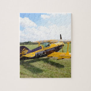 Aerobatic Bi-Plane On The Field Jigsaw Puzzle