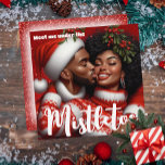 African American Couple Christmas Mistletoe Kiss Holiday Card<br><div class="desc">Celebrate the magic of the season with our enchanting Christmas Mistletoe Kiss Greeting Card, featuring a beautifully illustrated African American couple. Dressed in cozy red and white attire, they share a playful kiss under the mistletoe. This card is the perfect way to express love and warmth during the holidays. Whether...</div>