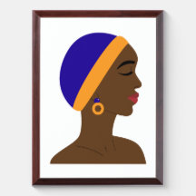 African woman in profile with blue and yellow cap