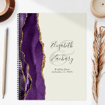 Agate Geode Purple Gold Ivory Wedding Plans Planner<br><div class="desc">This elegant modern wedding planner features a purple watercolor design trimmed with faux gold glitter. Easily customize the charcoal gray text on an ivory background, with the names of the bride and groom in handwriting calligraphy over a large ampersand. Add the title and wedding date below in italics. The back...</div>