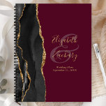 Agate Geode Script Black Gold Burgundy Wedding Planner<br><div class="desc">This elegant modern wedding planner features a black watercolor design trimmed with faux gold glitter. Easily customize the gold colored text on a burgundy background, with the names of the bride and groom in handwriting calligraphy over a large ampersand. Add the title and wedding date below in italics. The back...</div>