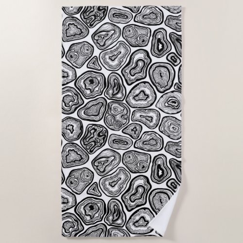 Agate slices in black and white beach towel