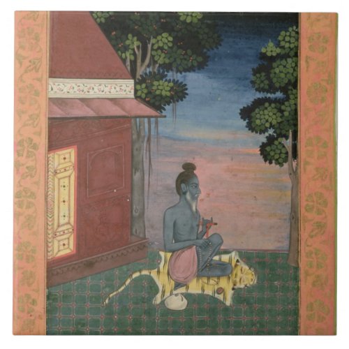 Aged ascetic seated on a tiger skin outside a buil tile