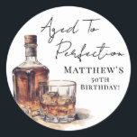 Aged To Perfection Birthday Classic Round Sticker<br><div class="desc">Aged To Perfection 50th Birthday Round Sticker. Celebrate a milestone with this whiskey-themed round sticker featuring a bold watercolor whiskey bottle and glass at the bottom left. The top right showcases “Aged To Perfection” along with the birthday person’s name and age in black fonts, using a mix of rustic handwritten...</div>