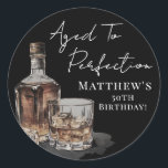 Aged To Perfection Birthday Classic Round Sticker<br><div class="desc">Aged To Perfection 50th Birthday Round Sticker. Celebrate a milestone with this whiskey-themed round sticker featuring a bold watercolor whiskey bottle and glass at the bottom left. The top right showcases “Aged To Perfection” along with the birthday person’s name and age in a mix of rustic handwritten script and classic...</div>