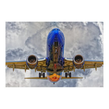 Airliner on final approach with very cloudy skies