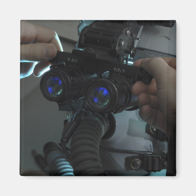 Airman adjusts the eyespan magnet (Front)