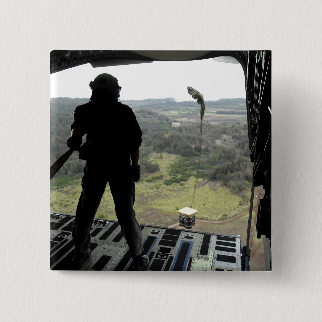 Airman watches a practice bundle fall button (Front)