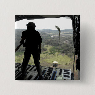 Airman watches a practice bundle fall button