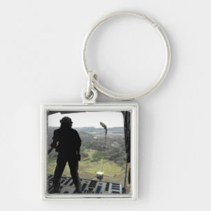 Airman watches a practice bundle fall keychain
