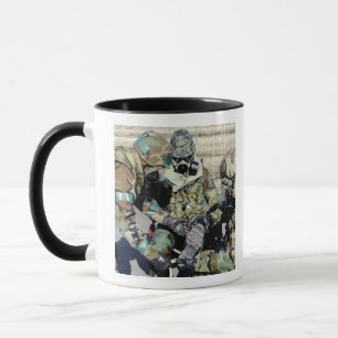 Airmen assist a Republic of Korea Army soldier Mug