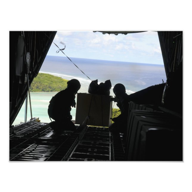 Airmen push out a pallet of donated goods 2 photo print (Front)