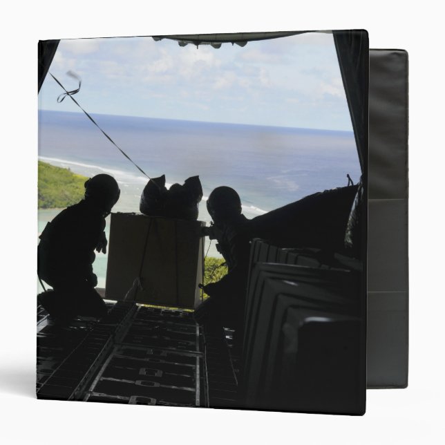 Airmen push out a pallet of donated goods 3 ring binder (Front/Inside)