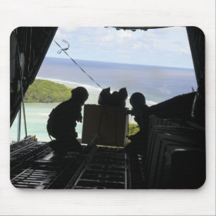 Airmen push out a pallet of donated goods mouse pad
