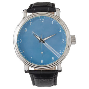 Airplane fly in the blue sky watch